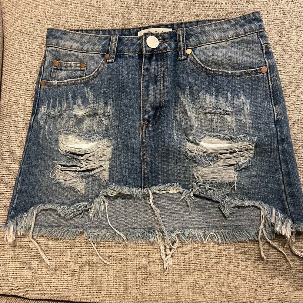 Caren Forbes distressed denim mini skirt